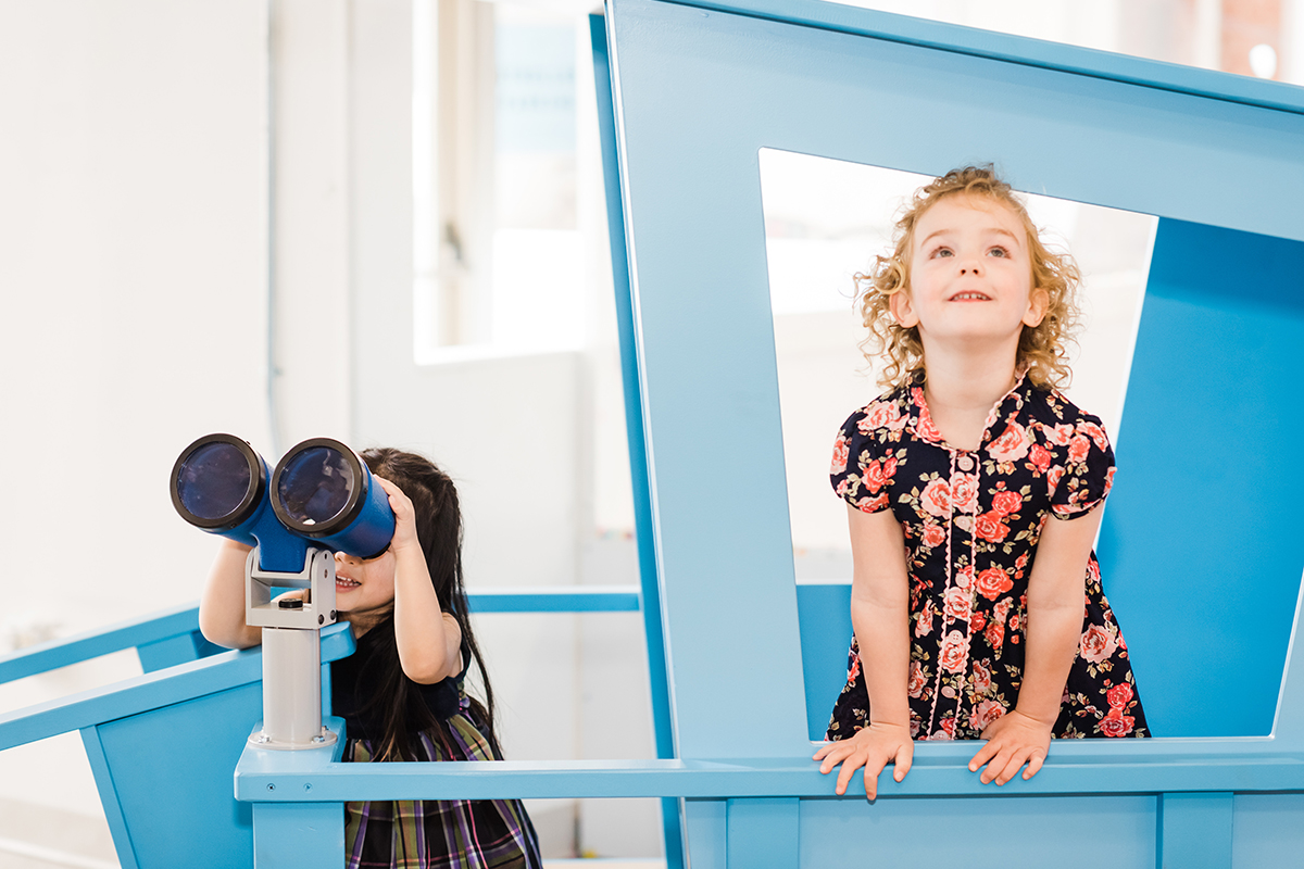 children using play binoculars